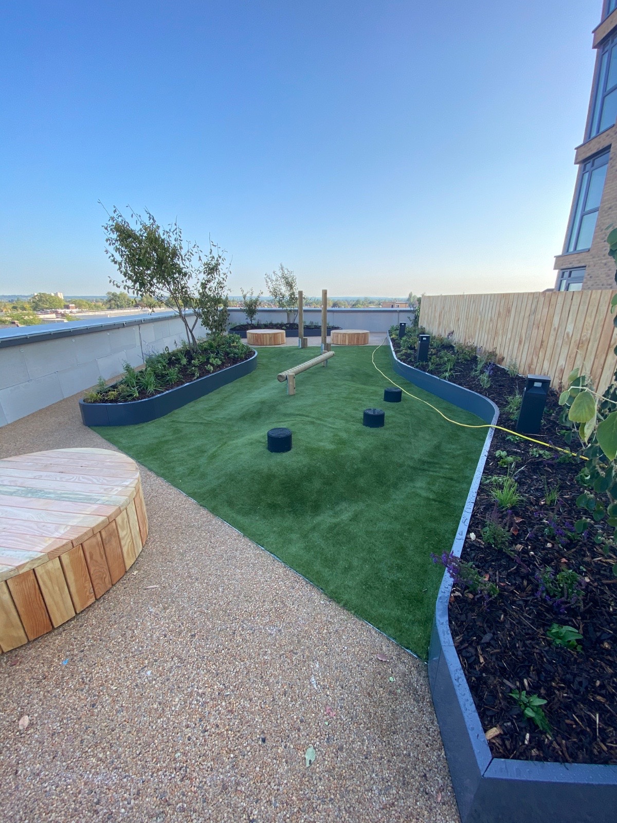 Resin bond, play equipments, turfing, metal planter installation and planting